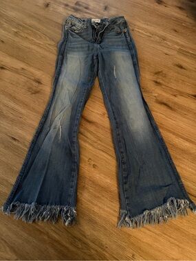 Women’s Blue Distressed Flare Jeans with Frayed Hem
